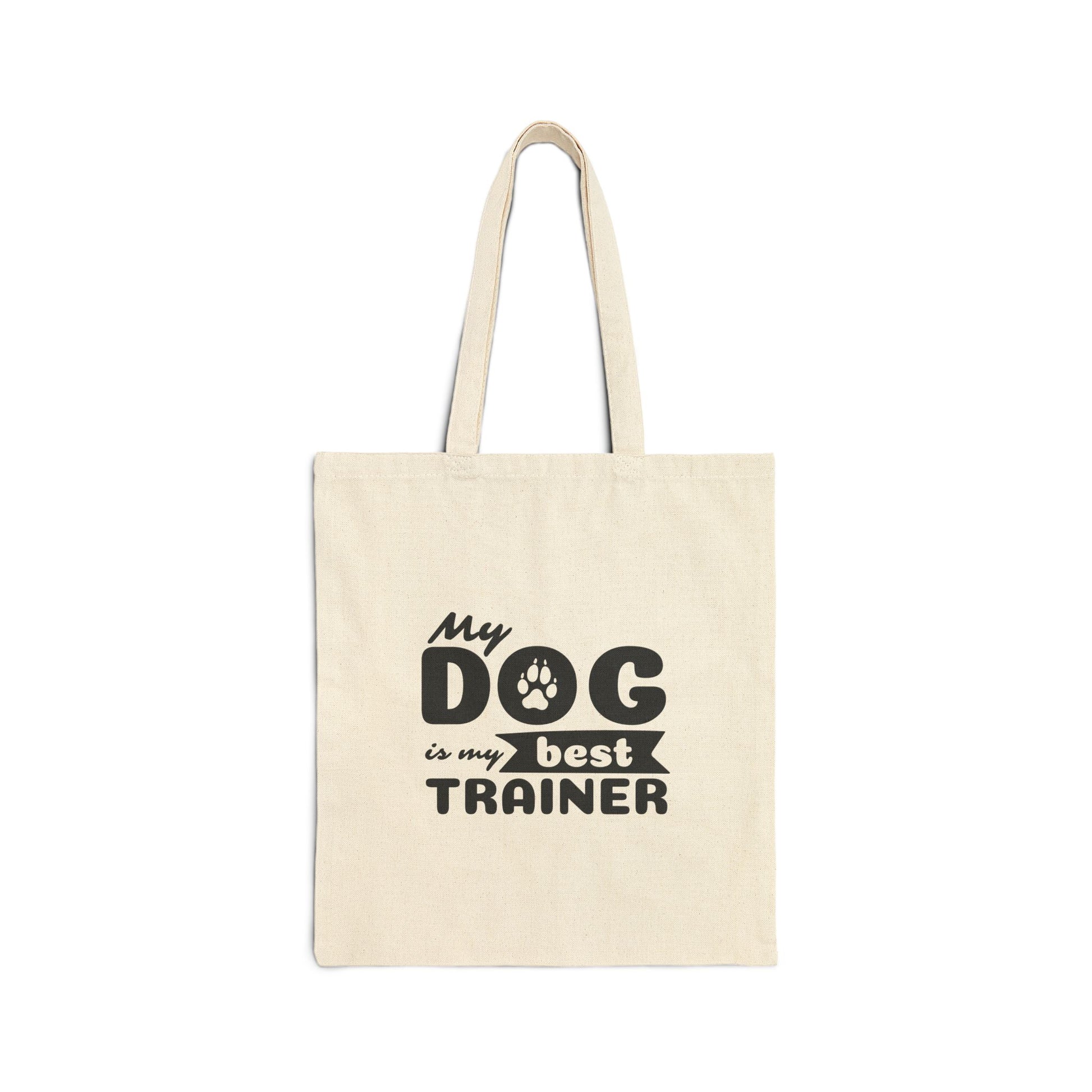 Beige tote bag with 'My dog is my best trainer' text on a white background