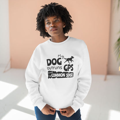 Person wearing a white sweatshirt with text and a dog graphic, standing against a light-colored wall.