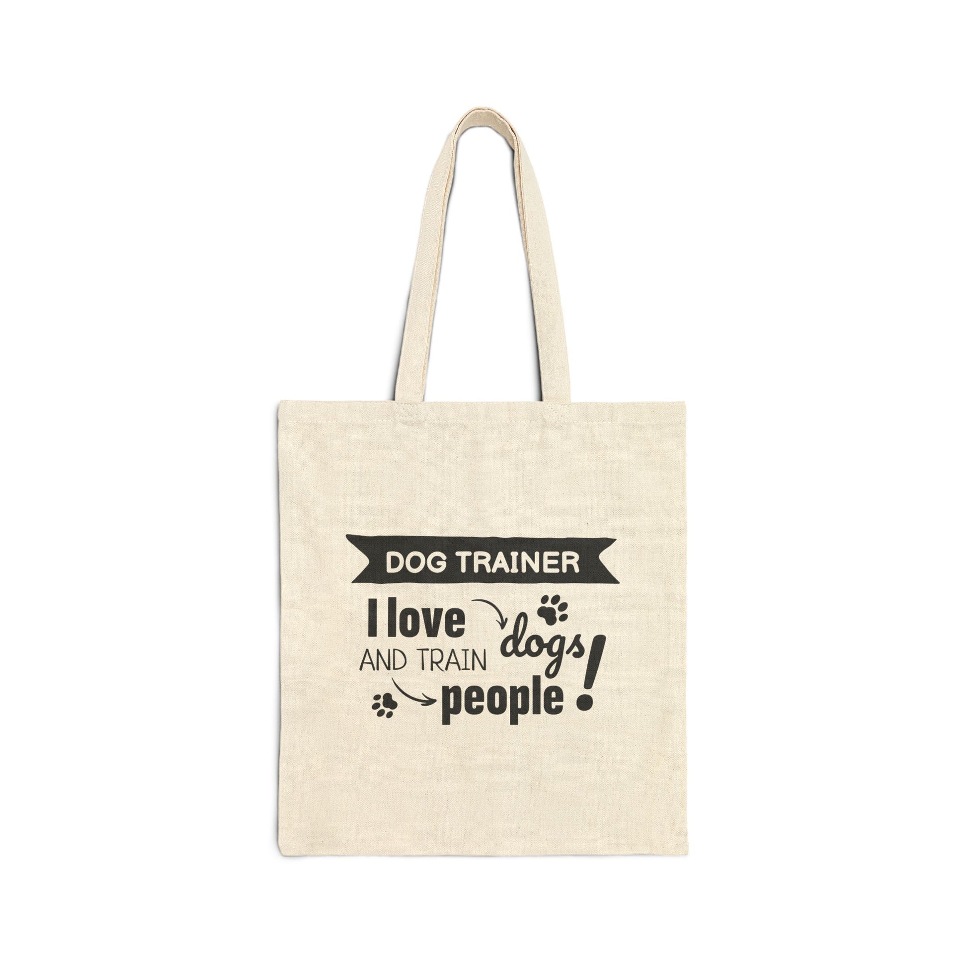 Beige tote bag with text 'Dog Trainer I love dogs and train people' on a white background