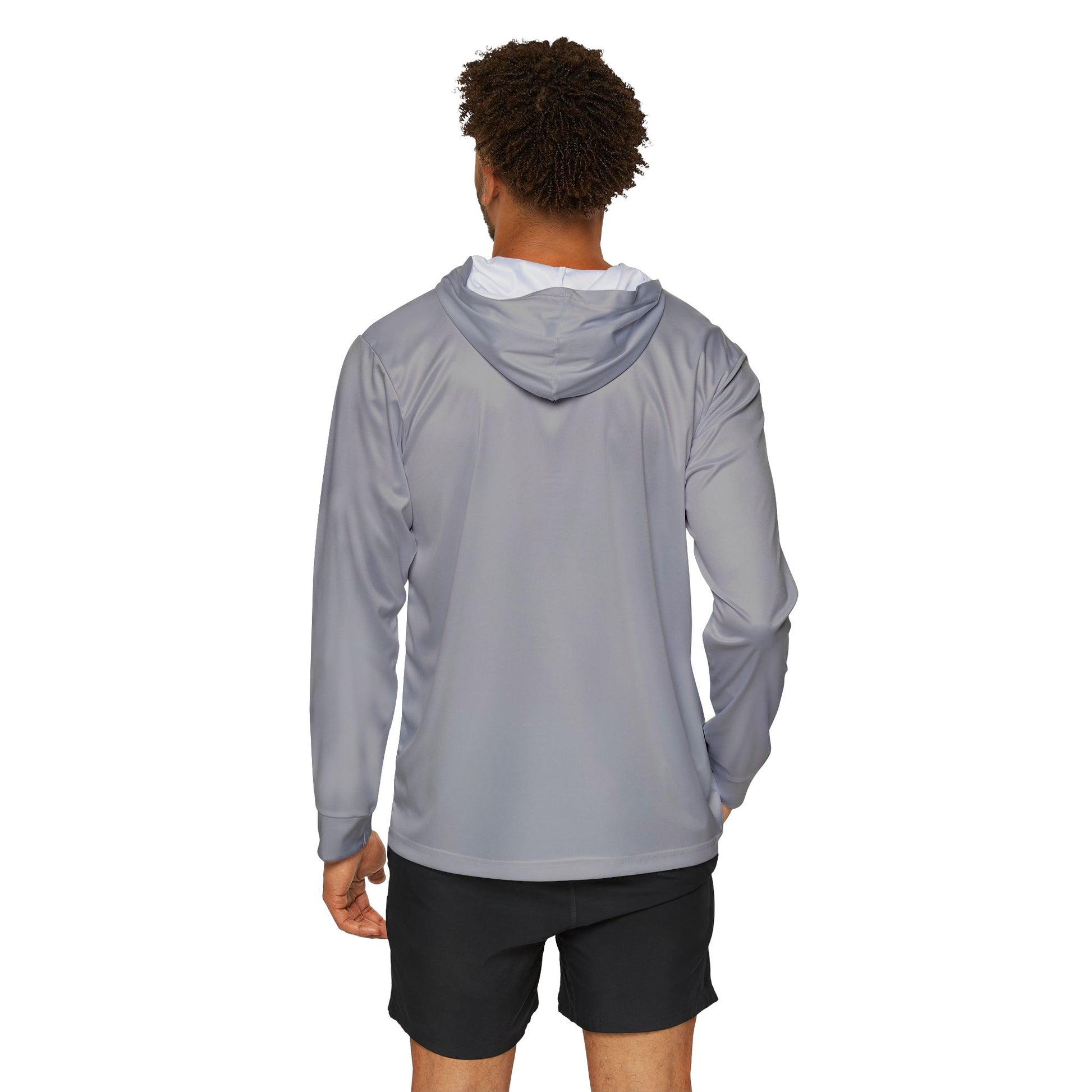 Person wearing a gray hoodie and black shorts on a white background