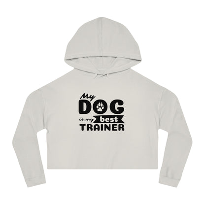 Light gray cropped hoodie with 'My dog is my best trainer' text on a white background