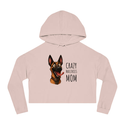 Pink cropped hoodie with a dog graphic and text on a white background