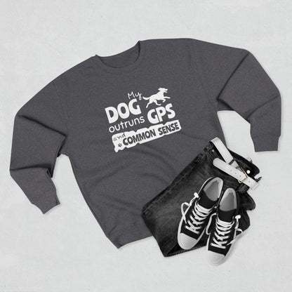 Gray sweatshirt with 'My dog outruns GPS and common sense' text, black jeans, and black sneakers on a light gray background