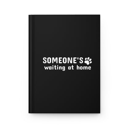 Black notebook with 'SOMEONE'S waiting at home' text on a white background