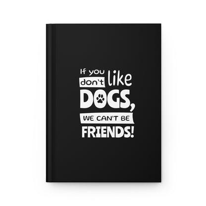 Black notebook with white text 'If you don't like dogs, we can't be friends!' on a white background