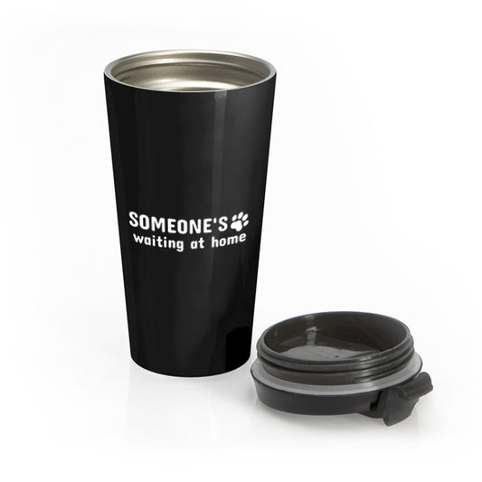 Black travel mug with 'SOMEONE'S waiting at home' text and paw print on a white background
