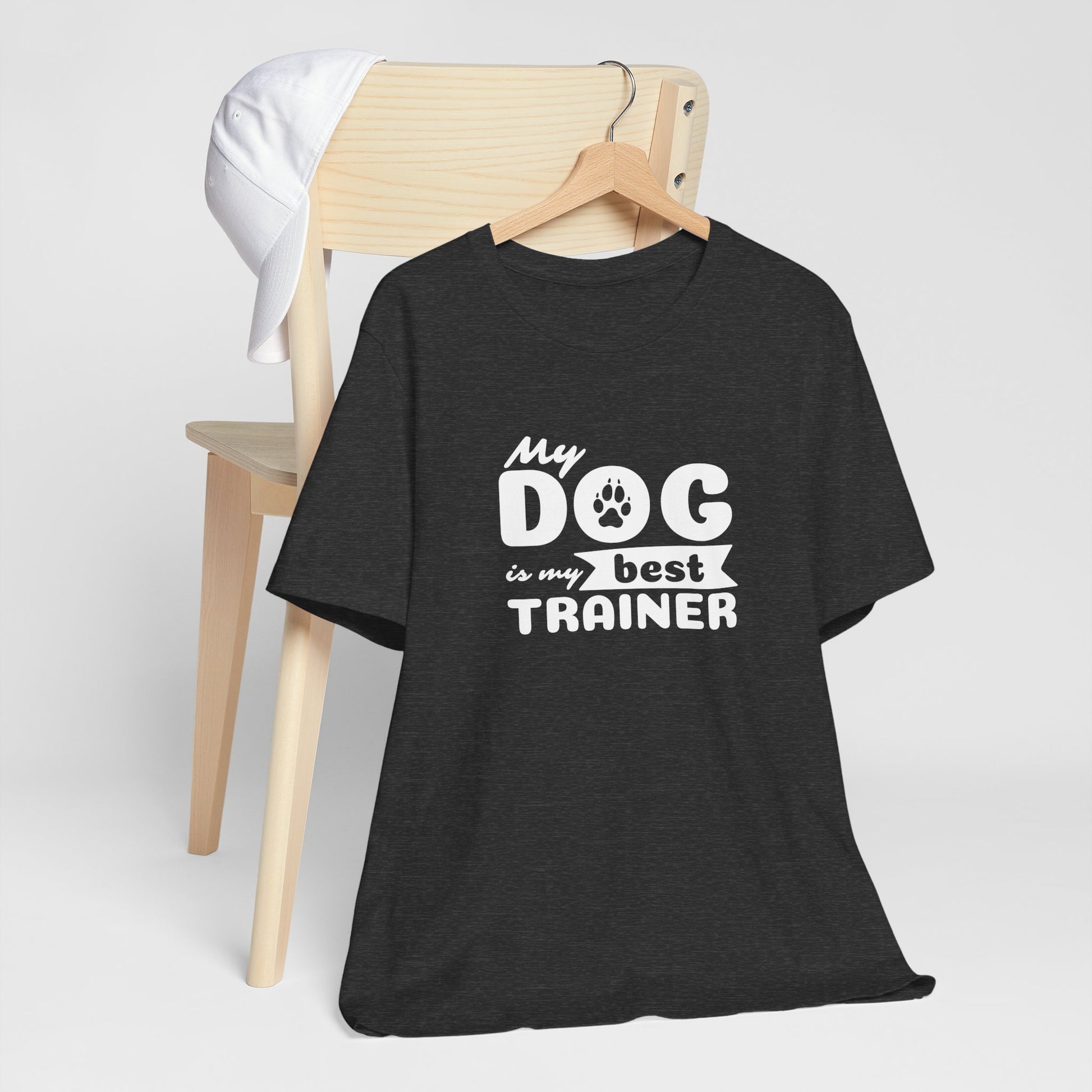 Black t-shirt with 'My dog is my best trainer' text on a white background