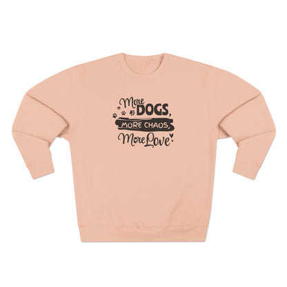 Pink sweatshirt with text 'More dogs, more chaos, more love' on a white background