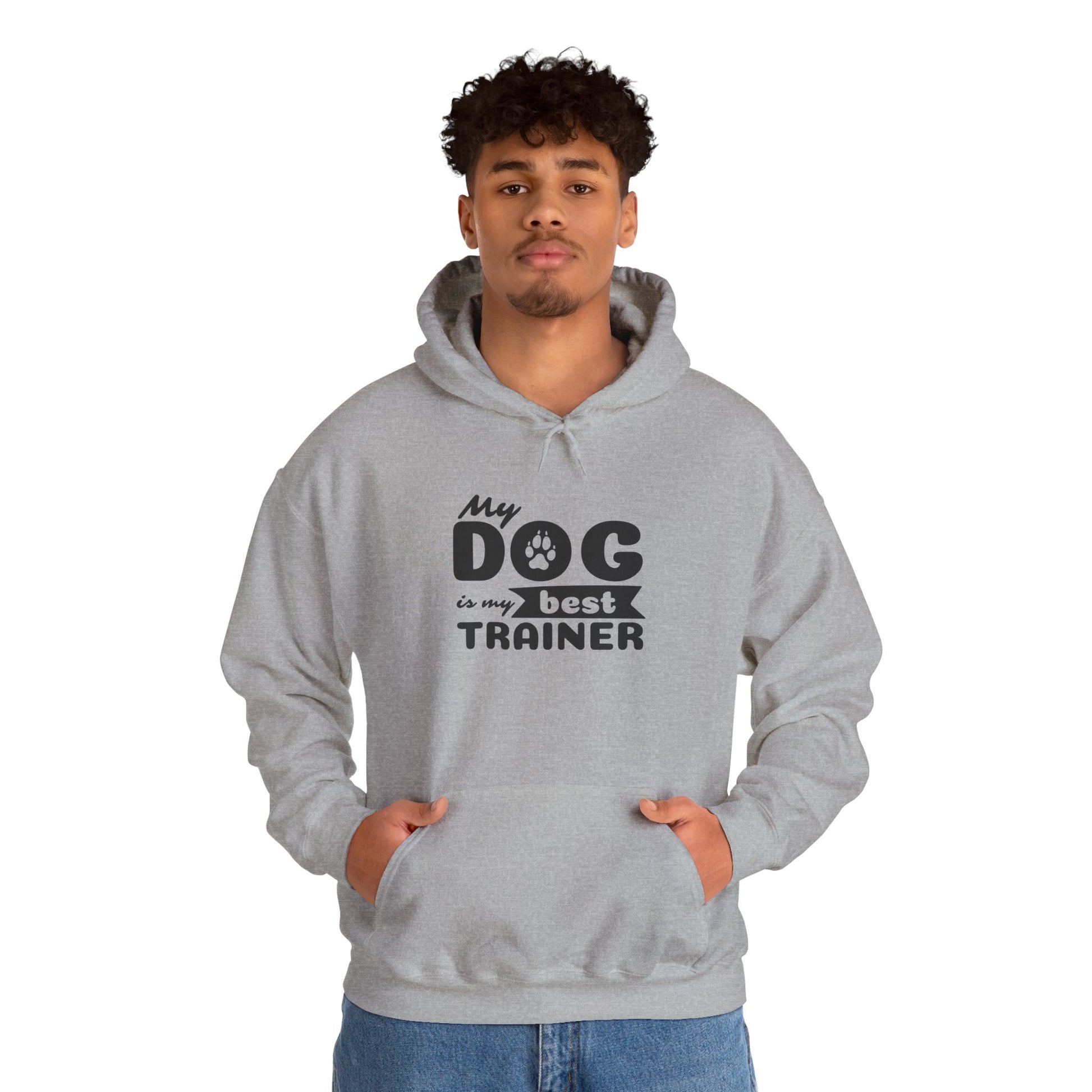 Person wearing a gray hoodie with 'My dog is my best trainer' text on a white background