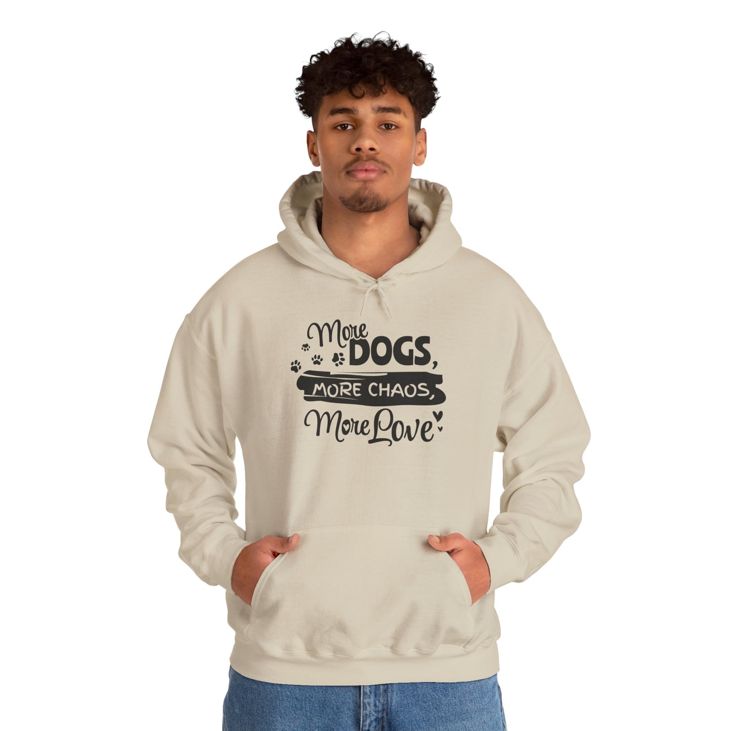 Person wearing a beige hoodie with text 'More Dogs, More Chaos, More Love' on a white background
