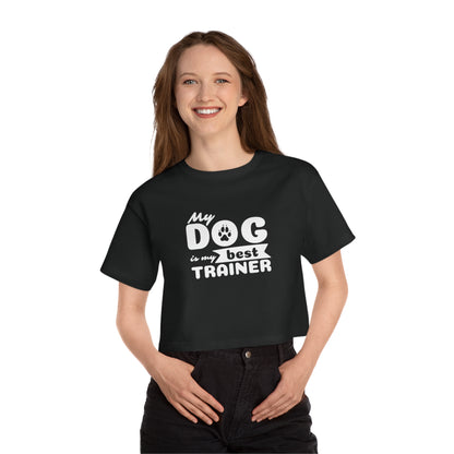 Person wearing a black t-shirt with 'My dog is my best trainer' text on a white background