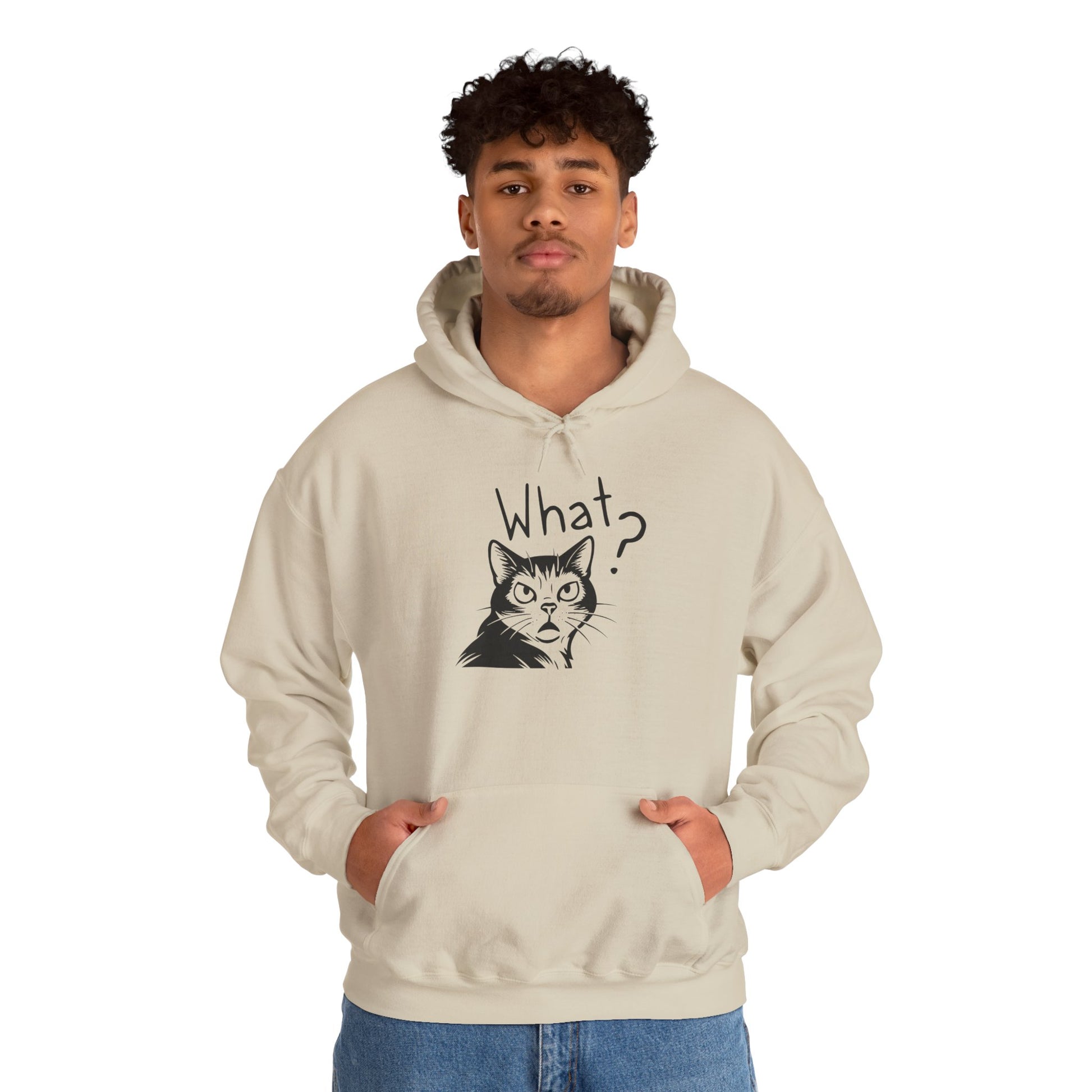 Person wearing a beige hoodie with a cat graphic and 'What?' text on a white background