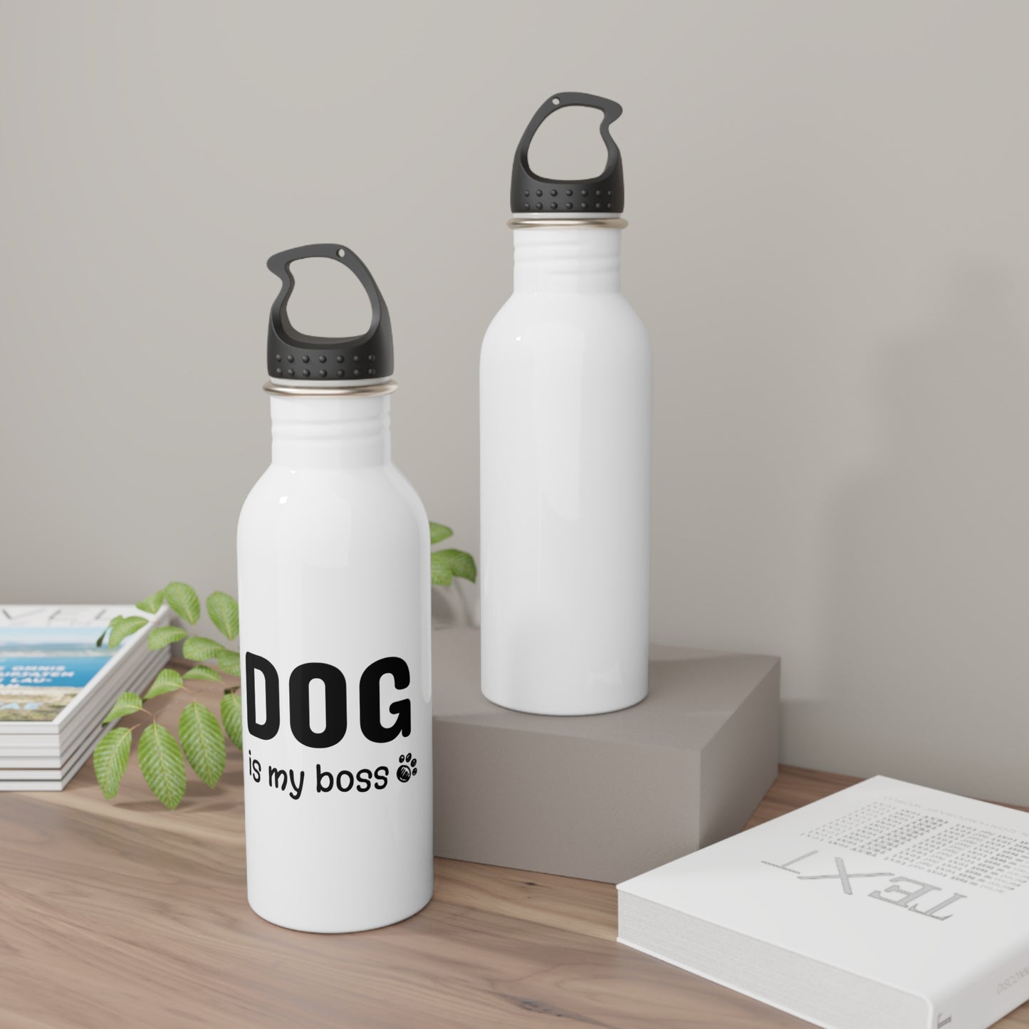 Two white water bottles with black text on a wooden surface.