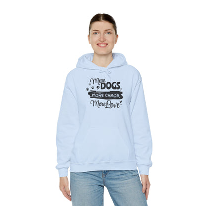 Light blue hoodie with text 'More Dogs, More Chaos, More Love' worn by a person on a white background