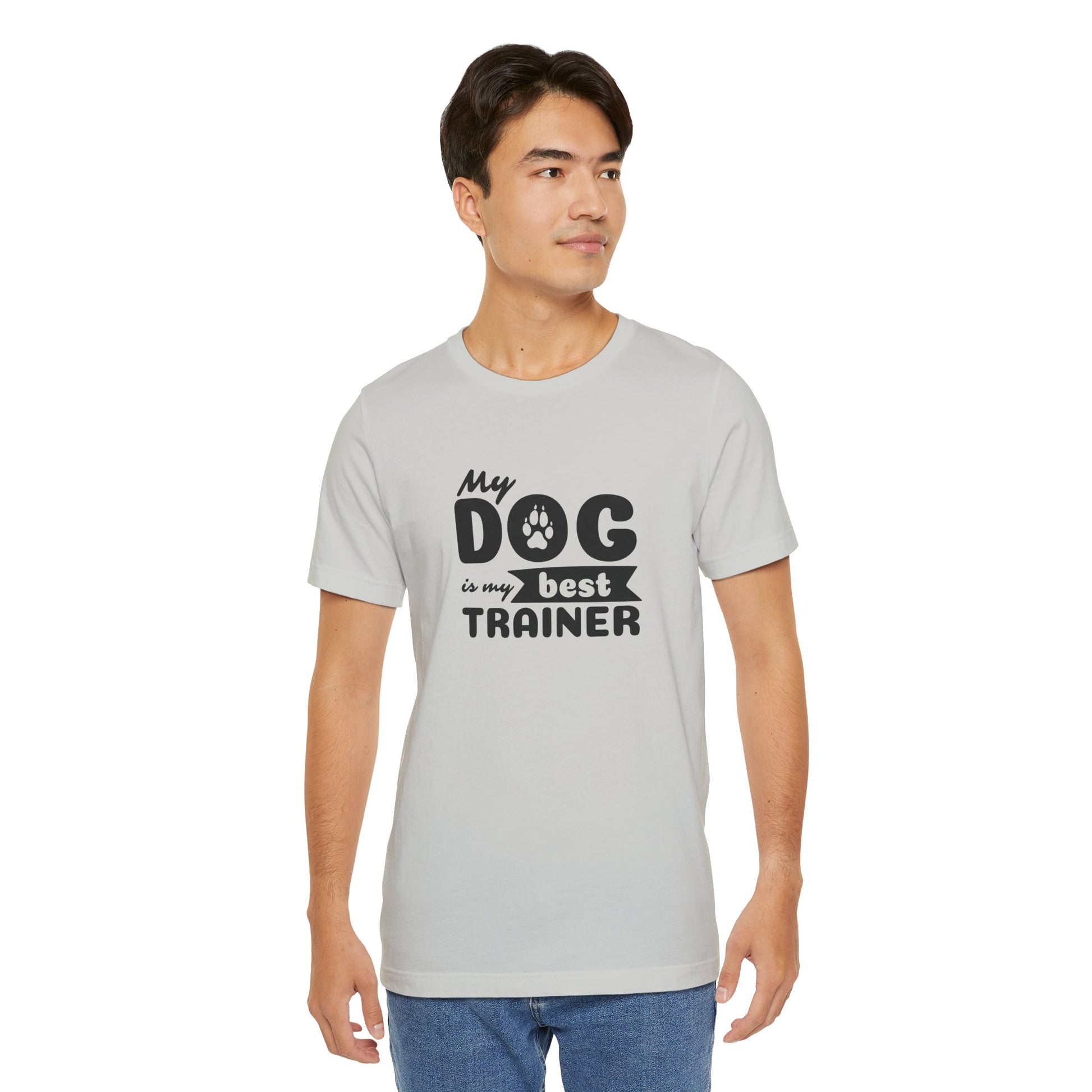 Man wearing a gray t-shirt with 'My dog is my best trainer' text on a white background