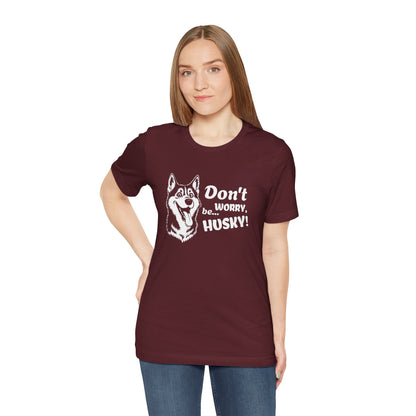 Woman wearing a maroon t-shirt with a husky graphic and text on a white background