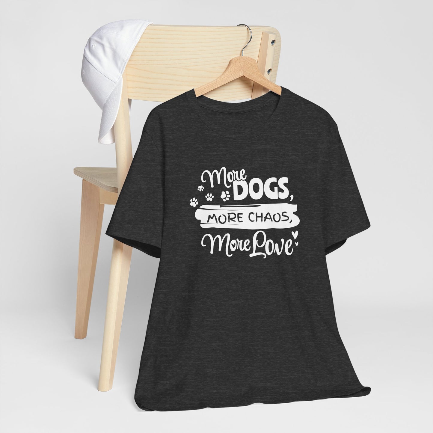 Black t-shirt with 'More Dogs, More Chaos, More Love' text on a white background
