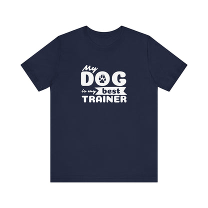 Navy blue t-shirt with white text 'My dog is my best trainer' on a white background