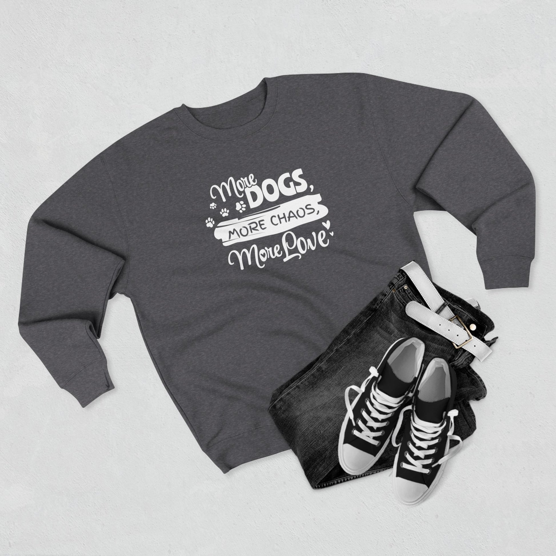 Gray sweatshirt with text 'More dogs, more chaos, more love' on a light gray background.