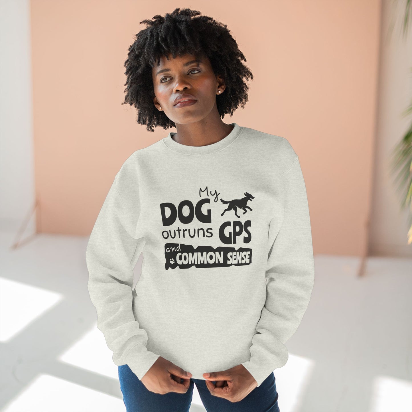 Person wearing a light gray sweatshirt with a humorous dog quote design.