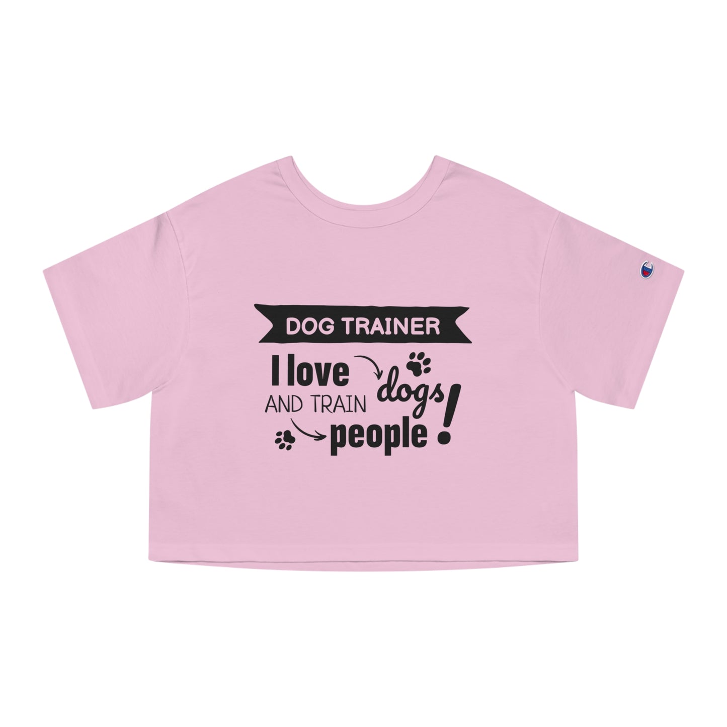 Pink crop top with black text 'Dog Trainer I love dogs and train people' on a white background