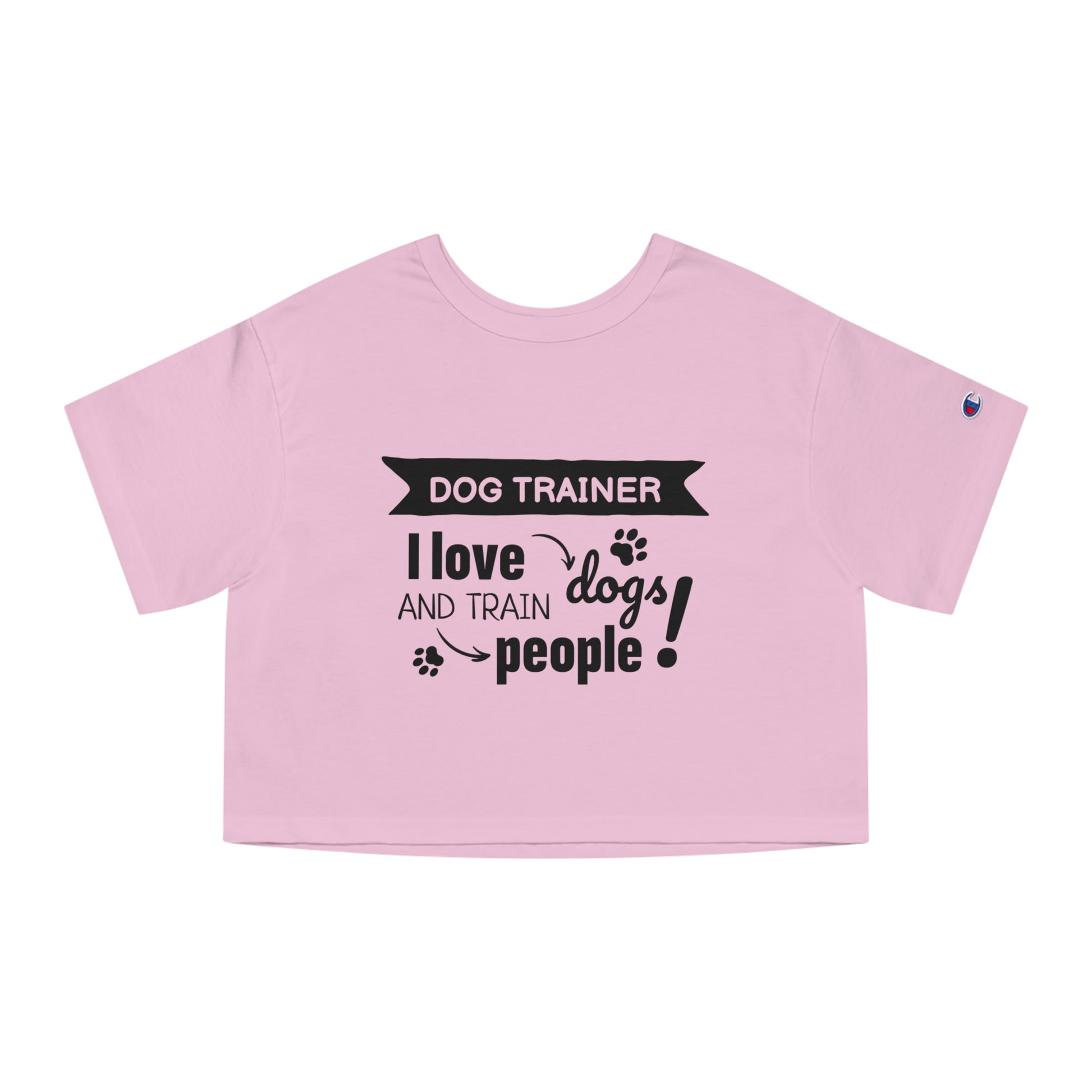 Pink crop top with black text 'Dog Trainer I love dogs and train people' on a white background