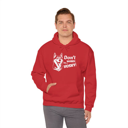 Person wearing a red hoodie with a husky graphic and text on a white background