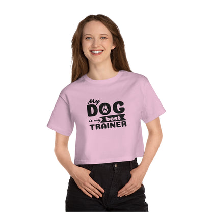 Person wearing a pink t-shirt with 'My dog is my best trainer' text on a white background