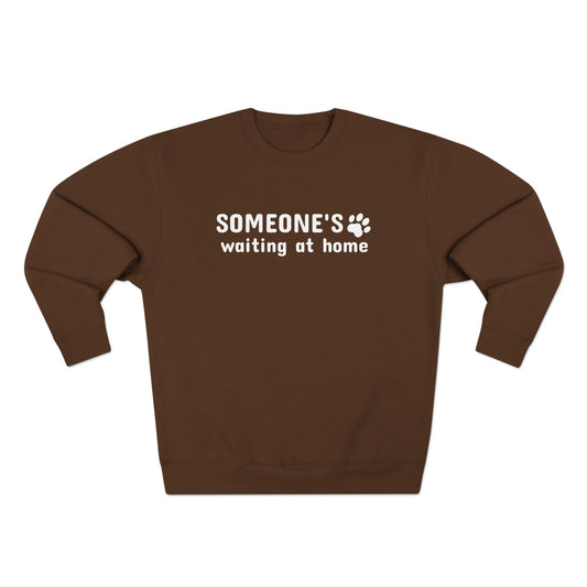 Brown sweatshirt with 'SOMEONE'S waiting at home' text on a white background