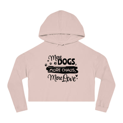 Pink cropped hoodie with text 'More Dogs, More Chaos, More Love' on a white background