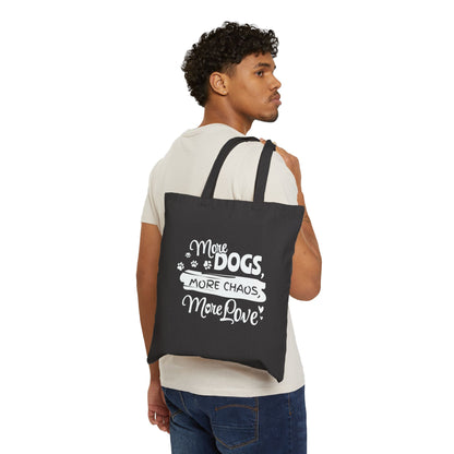 Man carrying a black tote bag with white text and graphics on a white background