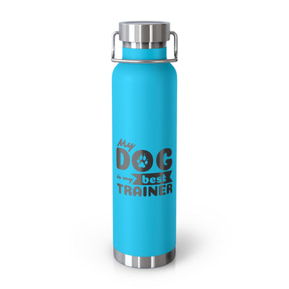 Blue water bottle with 'My dog is our best trainer' text on a white background