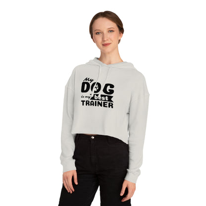 Person wearing a gray hoodie with 'My dog is my best trainer' text on a white background