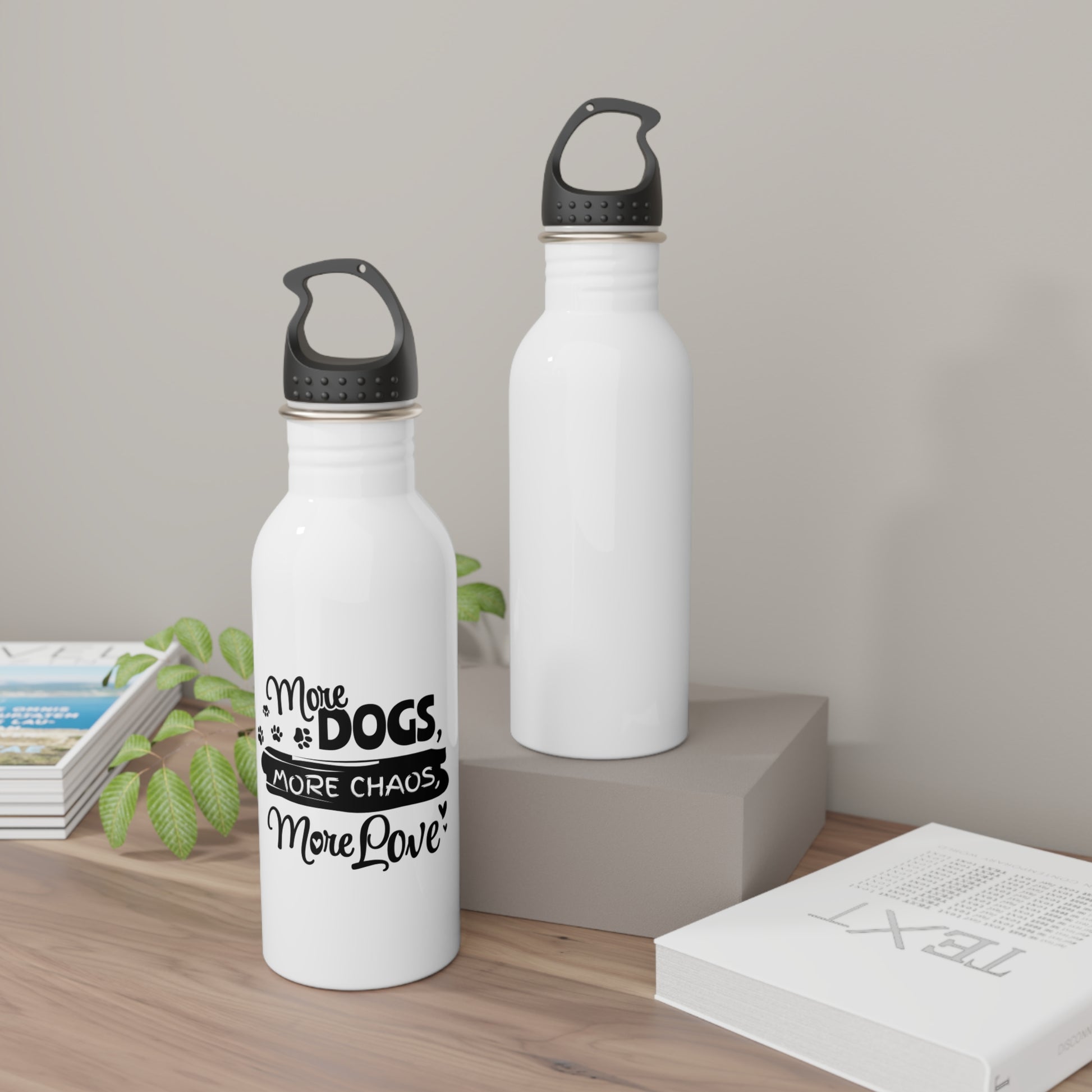 Two white water bottles with black text and black lids on a wooden surface.