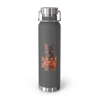 Gray water bottle with a dog and pumpkin design on a white background