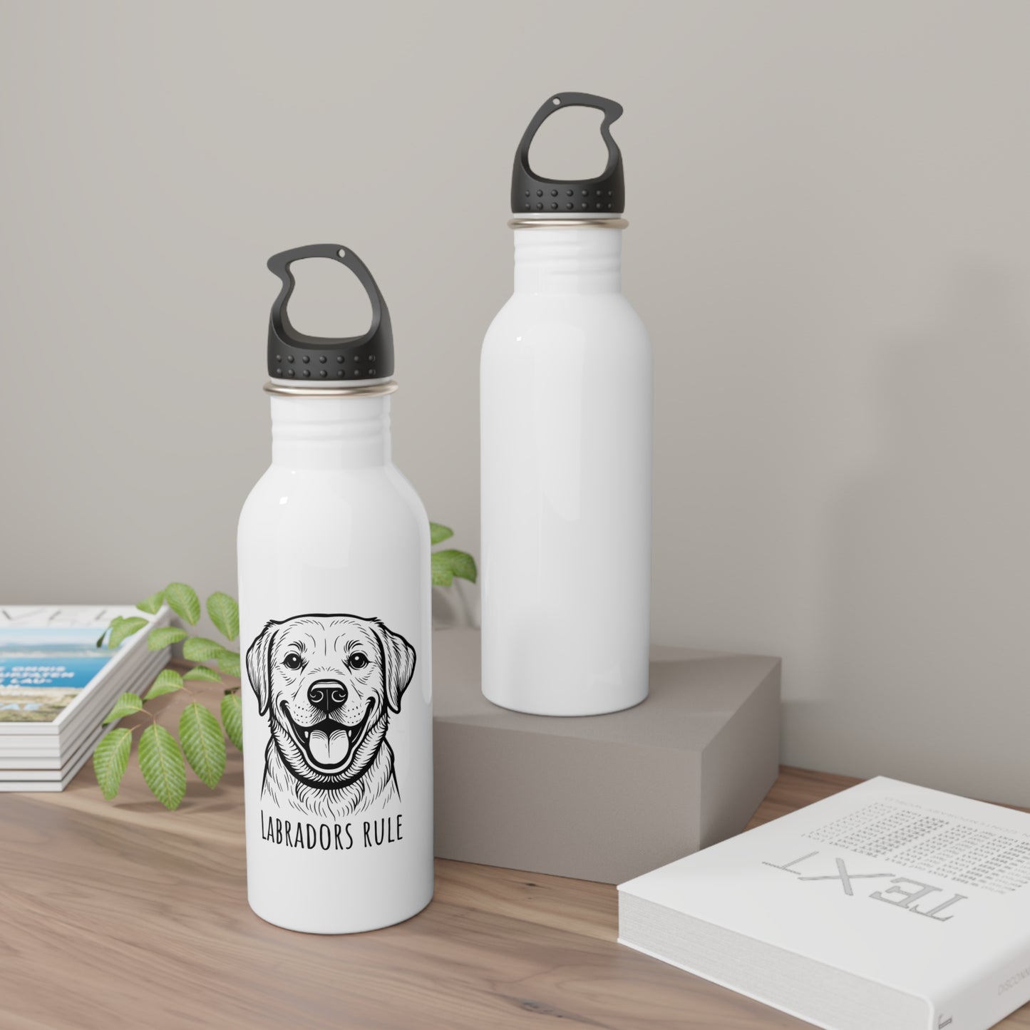 Two white water bottles with black labrador design and 'Labradors Rule' text on a wooden surface.