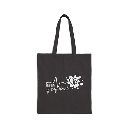 Black tote bag with 'Rhythm of My Heart' design on a white background