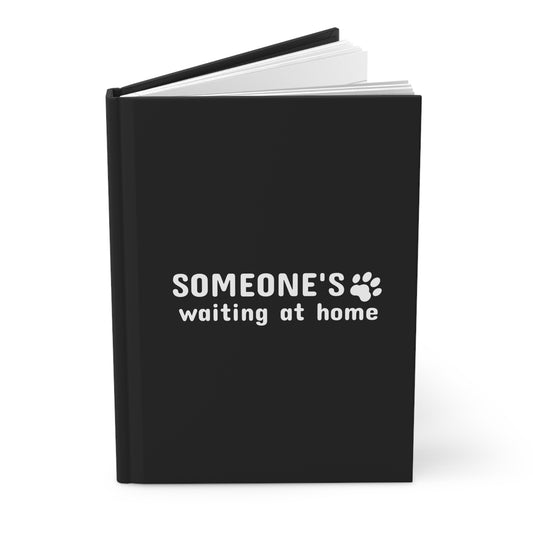 Black notebook with 'SOMEONE'S waiting at home' text on a white background