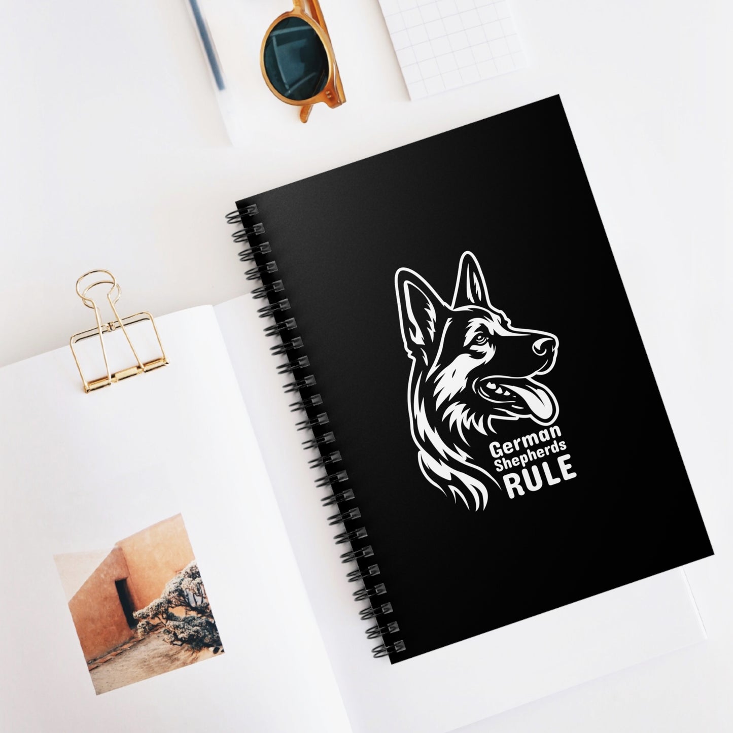 Black notebook with a German Shepherd design and 'German Shepherds Rule' text on a white surface.