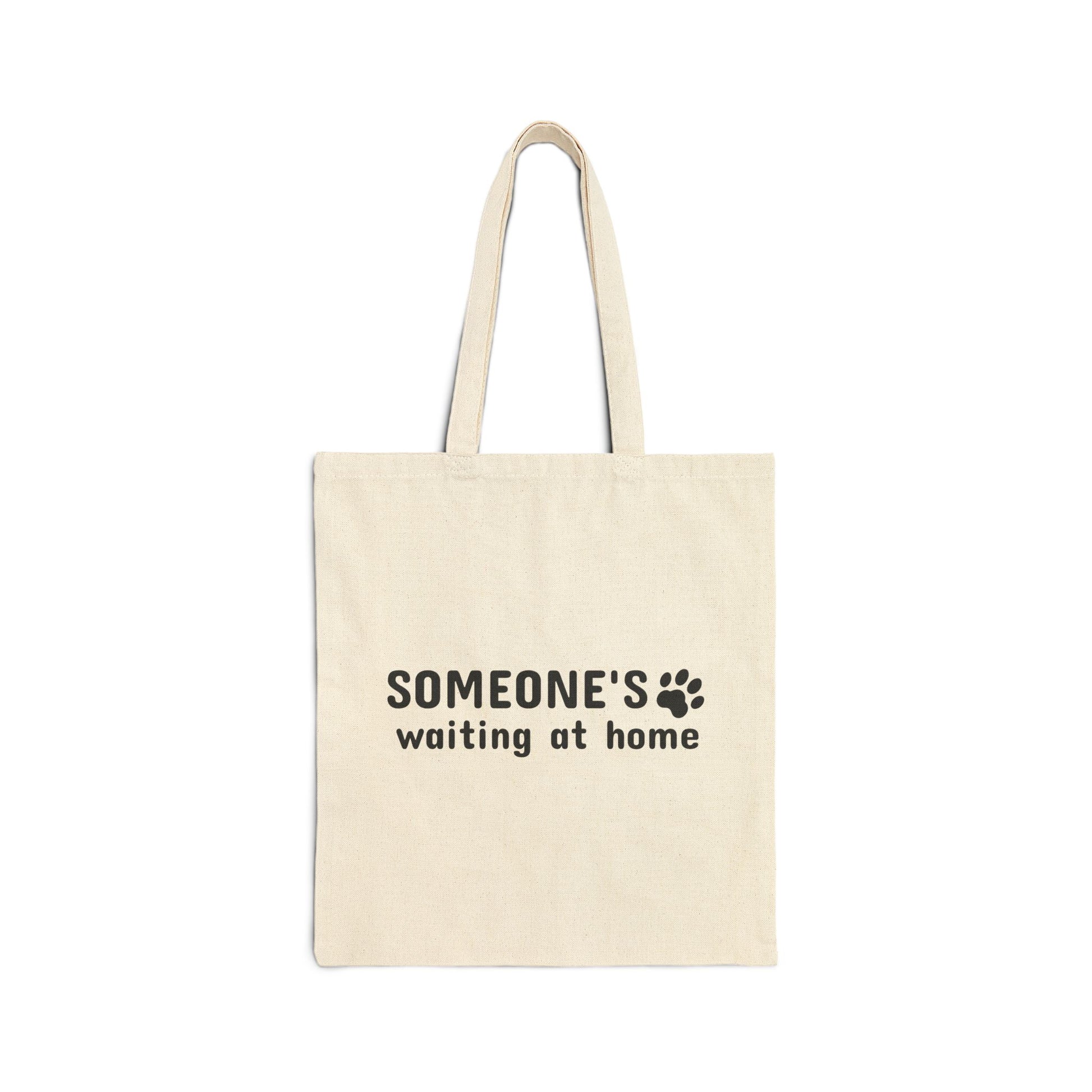 Beige tote bag with 'SOMEONE'S waiting at home' text on a white background