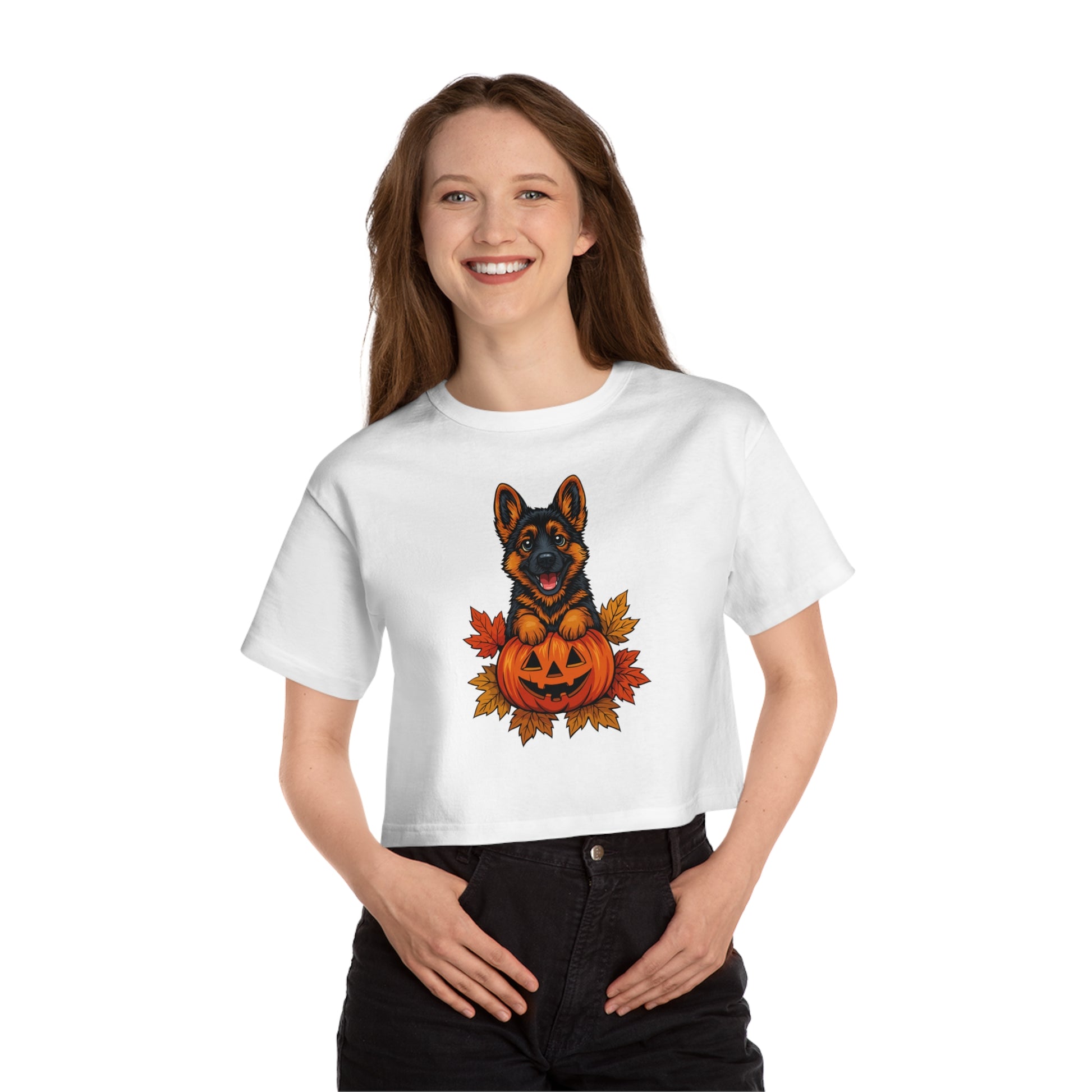 Person wearing a white t-shirt with a Halloween-themed design featuring a dog and pumpkin.