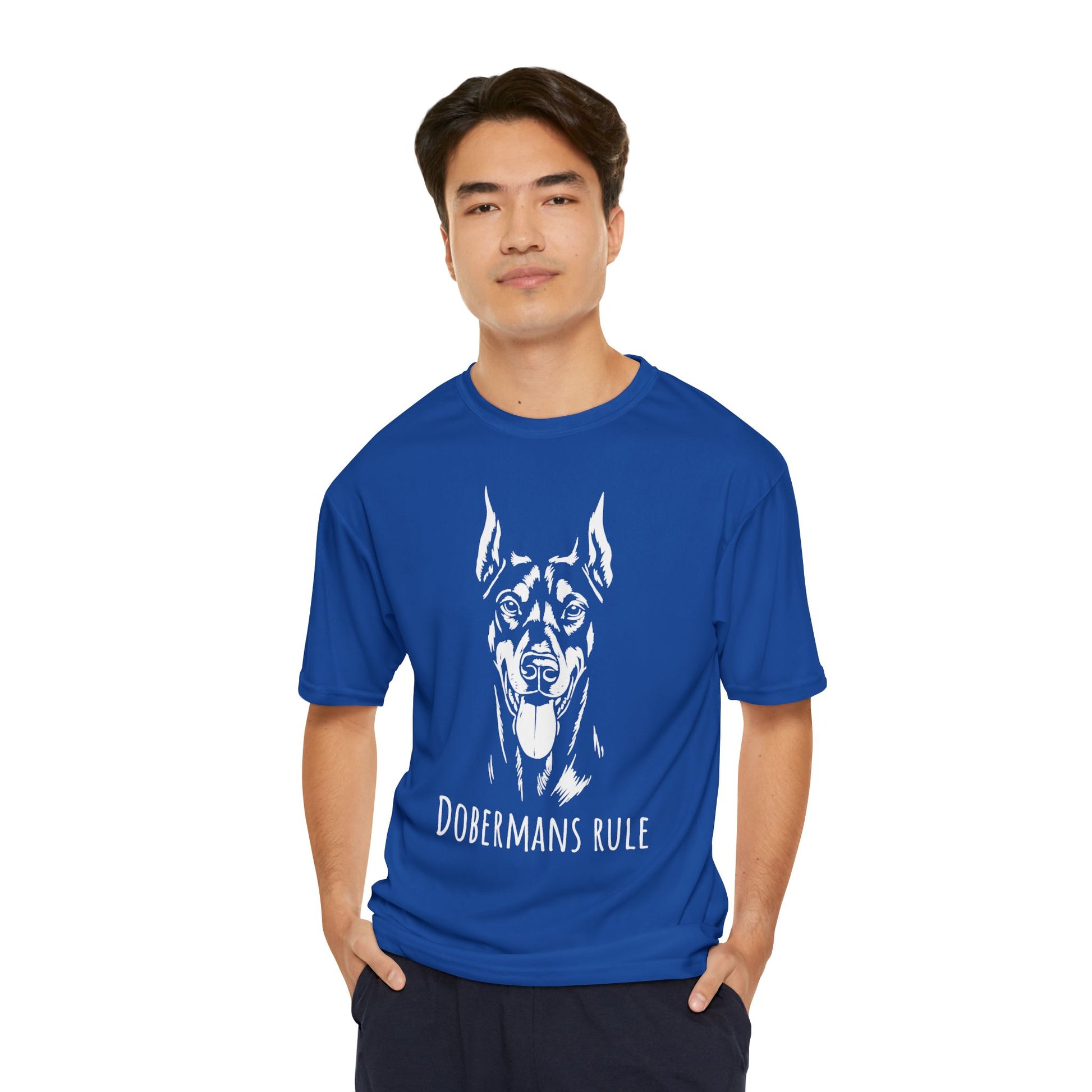 Man wearing a blue t-shirt with a dog graphic and 'Dobermans Rule' text on a white background